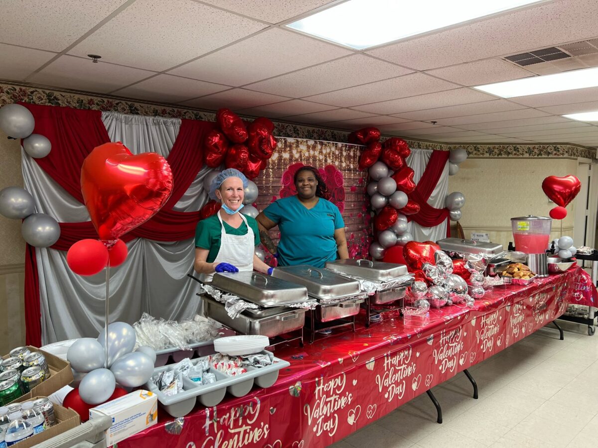 Nurses serving Valentine's Day meal at Reedy River Post Acute